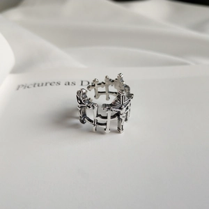 Macro shot of 925 sterling silver vintage crucifix ring with detailed religious carvings