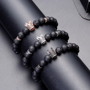 Three-piece set of 8mm lava rock bracelets with gold, silver, and black crown charms