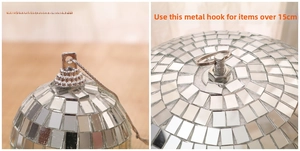 Detail view of disco ball hooks comparing standard loops with reinforced metal bolts
