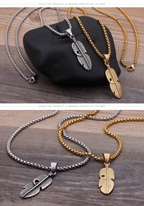Close-up of vintage feather pendants in silver and gold with intricate carving details