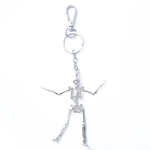 Silver metal skeleton keychain with lobster clasp and ring on a clean white background