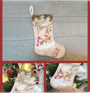 Detail of vintage reindeer and snowman print on a rustic hanging Christmas stocking