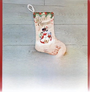 Detail of Christmas stocking with snowman illustration hanging on a tree with festive lights