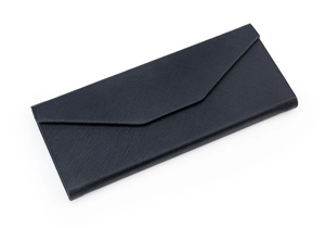 Close-up of black Saffiano leather texture on a triangular folding eyewear case