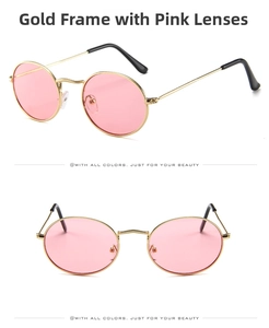Detail view of retro oval sunglasses with a slim gold metal frame and pink lenses