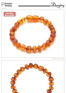 Detailed view of polished natural fire amber beads on a flexible children's bracelet