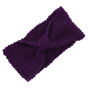 Deep purple chunky knit headband with twist knot design on a plain white background