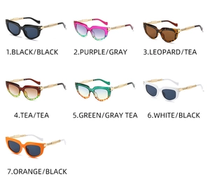 Detail view of cat eye sunglasses with metal chain temples in seven fashion color options
