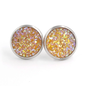 Detail of 12mm stainless steel stud earrings with orange and gold druzy faux crystals