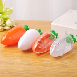 Creative carrot-shaped plastic candy storage boxes in orange and white for Easter decor