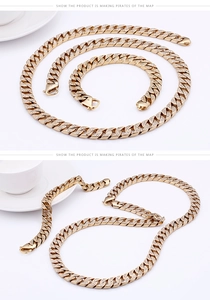 Detailed view of gold plated Cuban link necklace and bracelet set with iced-out crystals