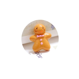 Resin gingerbread man DIY charm for phone cases and magnets with pink bow detail