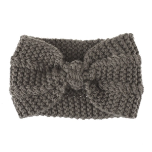 Macro view of thick knit texture and decorative twisted knot on grey headband