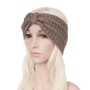 Close-up of brown chunky knit headband featuring stylish twist knot and thick yarn texture