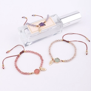 Close-up of handmade 4mm pink stone beaded bracelet with druzy charm and adjustable cord