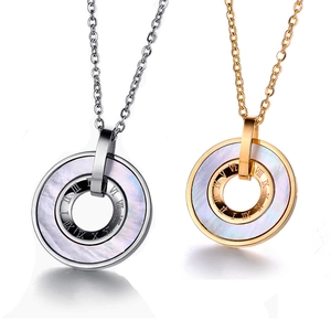 Detail of gold and silver necklaces with Roman numerals and mother-of-pearl inlays