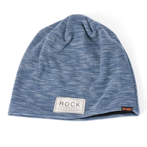 Detail showing blue knit beanie with ROCK label and warm double-layer lining detail