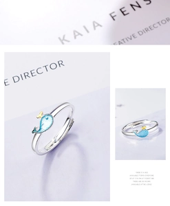 Macro detail of whale ring showing S925 silver stamp and blue enamel heart design