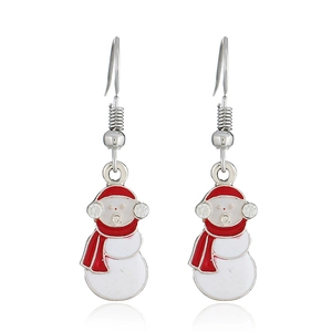 Detail view of snowman drop earrings with red enamel hats and sparkling crystal accents