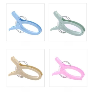 Set of four large plastic clothespins in pastel colors with non-slip handles and metal springs
