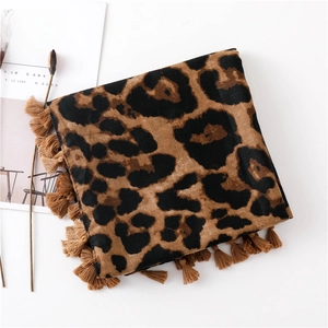 Detailed view of leopard print cotton scarf with tassel edges and soft texture