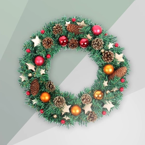 Christmas wreath with pine needles, cones, red balls, and wooden stars on festive garland