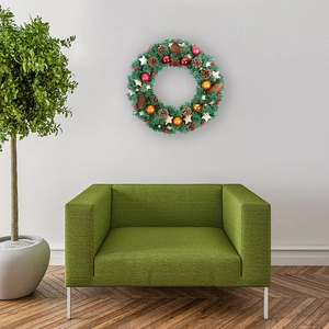 Nordic Christmas wreath with red ornaments, pine cones and wooden stars on white wall