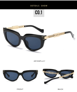 Detail view of cat eye sunglasses featuring gold metal hollow chain arms and dark blue lenses