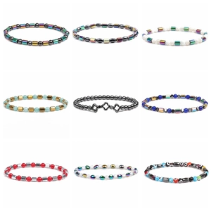 Detail of 6mm hematite beaded bracelets with rainbow and evil eye charms in 3x3 grid