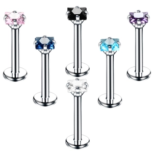 Macro shot of colorful square zircon lip studs in stainless steel with pyramid layout