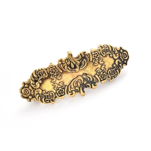 Gouden vintage haarklem met zwarte bloemgravures en een elegant retro krulpatroon