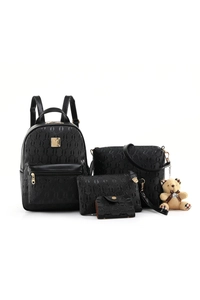 Detail of 4-piece black embossed leather set including backpack and bear keychain