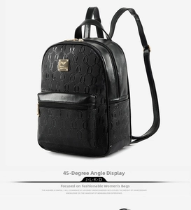 Detail of black PU leather backpack with embossed chain pattern and gold zipper