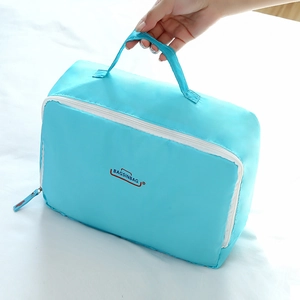 Sky blue waterproof travel storage bag with white U-shaped zipper and handle