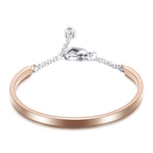 Modern rose gold and silver U-shaped bangle with heart charm and adjustable lobster clasp