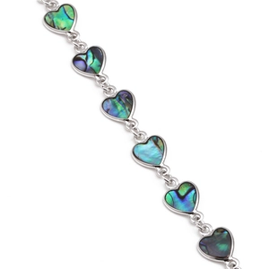 Silver-toned heart link bracelet inlaid with colorful abalone shell on white background