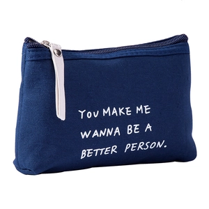 Dark blue canvas makeup bag with white zipper and printed motivational English text