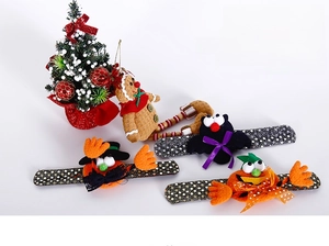 Detail of Halloween slap bracelets with pumpkin and bat designs in festive colors