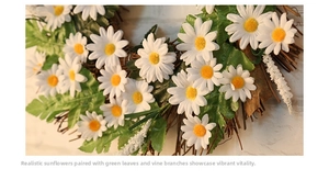 Detail of faux white daisies and green leaves on a rustic rattan wreath ornament