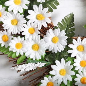 White daisy wreath with green leaves and brown twig base for wall or door decoration