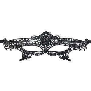 Detail shot of black lace masquerade mask with intricate embroidery and silk ribbons