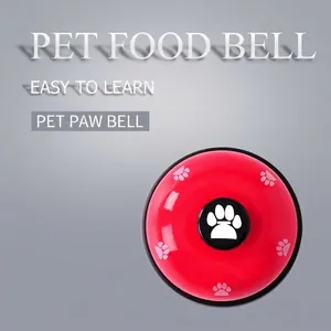 Red mechanical pet training bell with white paw prints for dogs and cats interaction