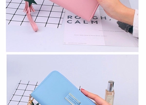 Detail of pink and blue long wallets with lychee texture and star charms