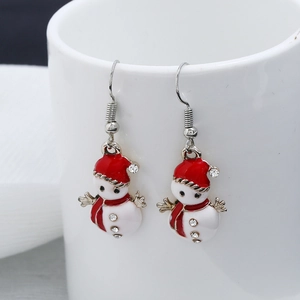 Close-up of Christmas snowman earrings with red and white enamel and rhinestone accents