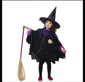 Detail of children's witch costume with purple trim hat and matching cape for Halloween