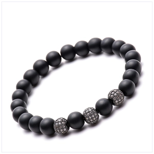 Macro detail of 8mm matte black stone beads with micro-pave zircon silver accent balls