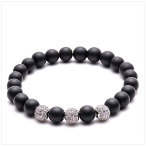 Detail of 8mm matte black stone beads bracelet with three silver micro-paved zircon spheres
