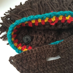 Creative handmade Rasta knit beanie with colorful stripes and button detail for unisex