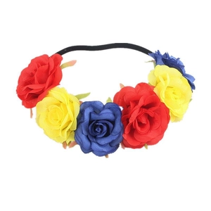 Detail showing artificial roses on an elastic flower headband in red, yellow, and blue