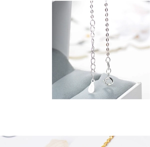 Detailed macro view of S925 sterling silver extension chain with hallmark tag on jewelry box